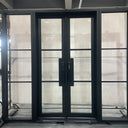 Exterior iron entry door with two sidelights and top transom