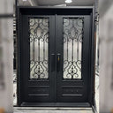 Custom iron double entry door with privacy glass and kickplate panels