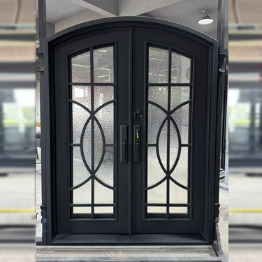 Custom arched iron double entry door with glass panels