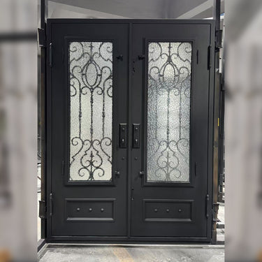 Black wrought iron double entry door with lower kickplates