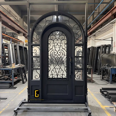 Arched iron single front door with sidelights and round transom