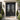 Square frame wrought iron double door with rainstorm glass and scrollwork