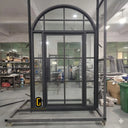 Single iron French front door with side lights and upper round transom