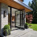 Modern thermal break pivot entry door with clear glass and black frame