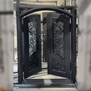 Iron double door with scrollwork and curved panel details