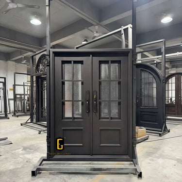 Custom iron double entry door with divided glass panels