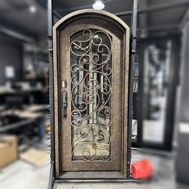 Decorative wrought iron single door with arched top
