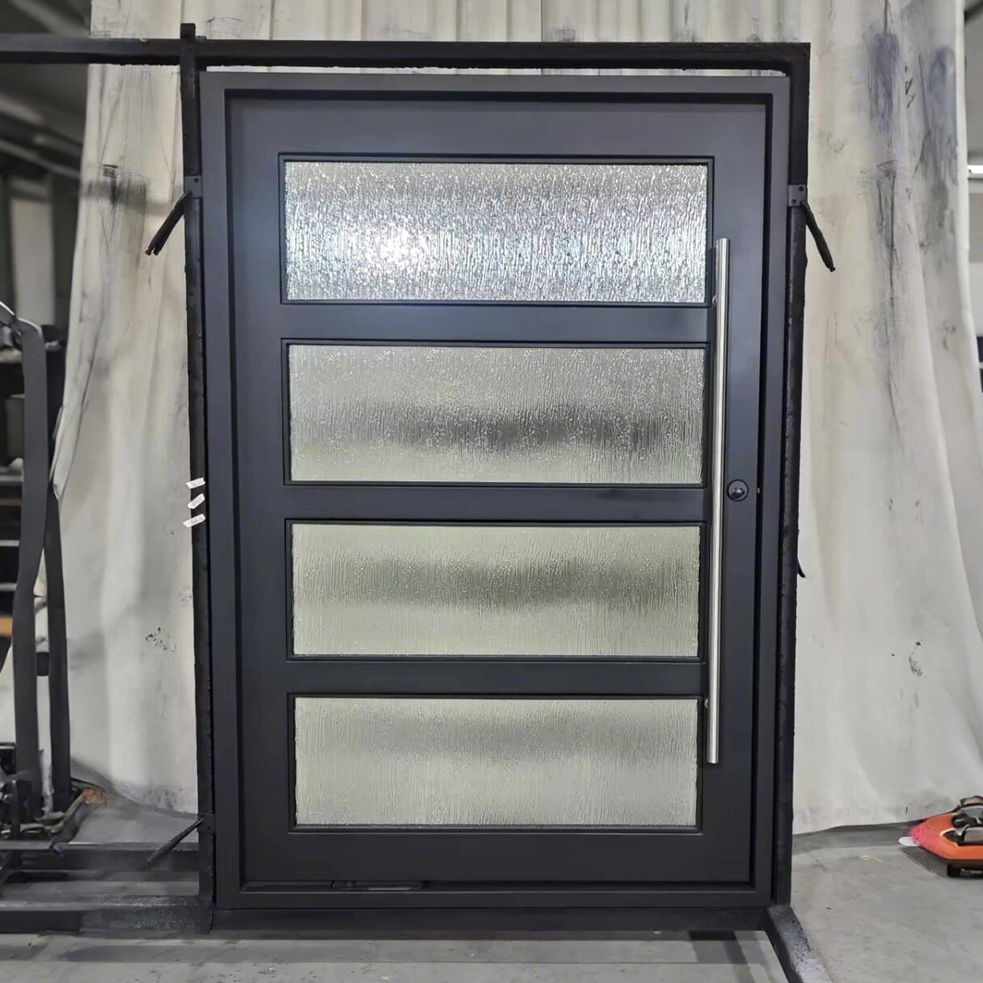 gid wrought iron pivot entry door with thick frame and long stainless handle