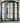 Exterior iron entry door with sidelights and arched top