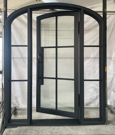 Exterior iron entry door with sidelights and arched top