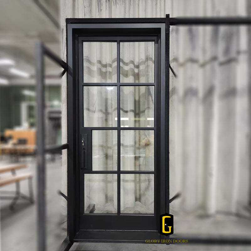 Custom iron single front door with divided glass