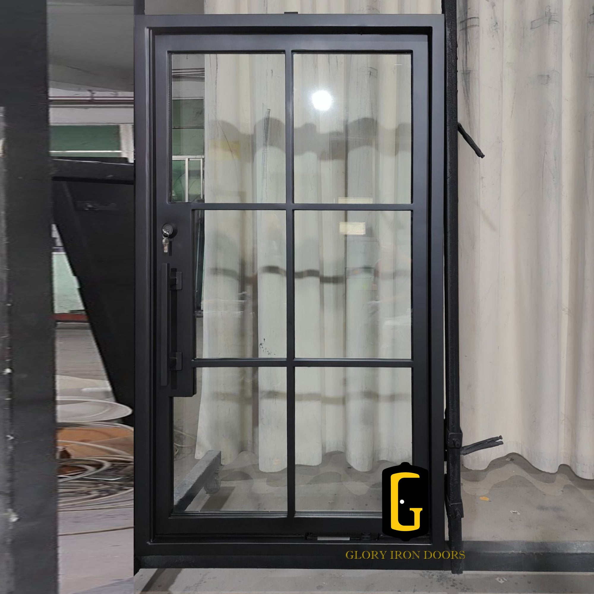 gloryirondoor iron pivot single door with black color and clear glass