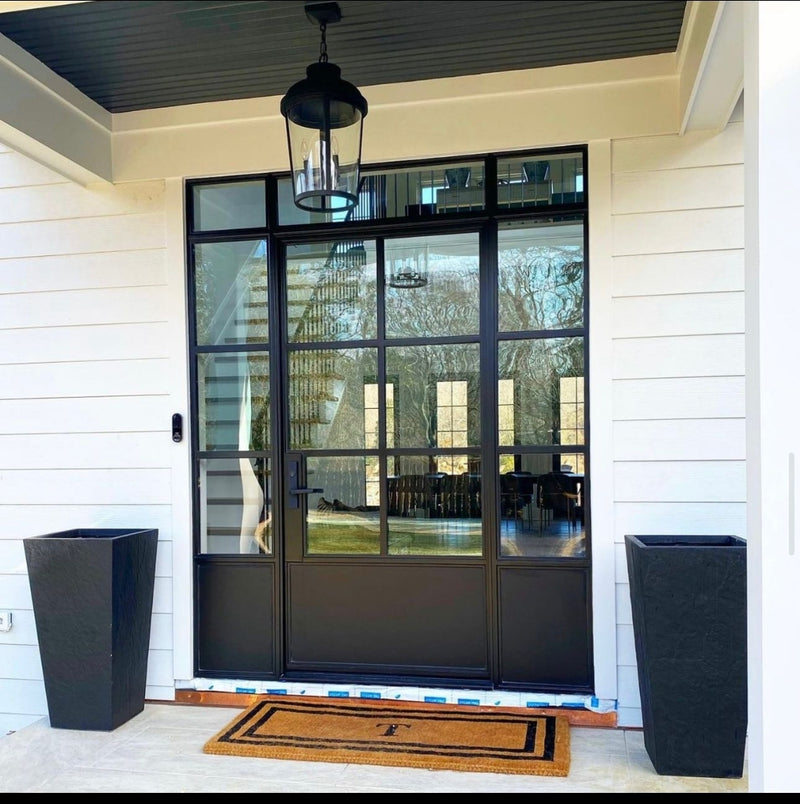 Iron French front door with sidelights and kickplate