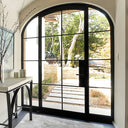 Arched iron French front door with double sidelights