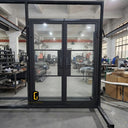 Custom iron French entry door system for exterior opening