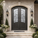 Decorative iron double entry door with textured glass