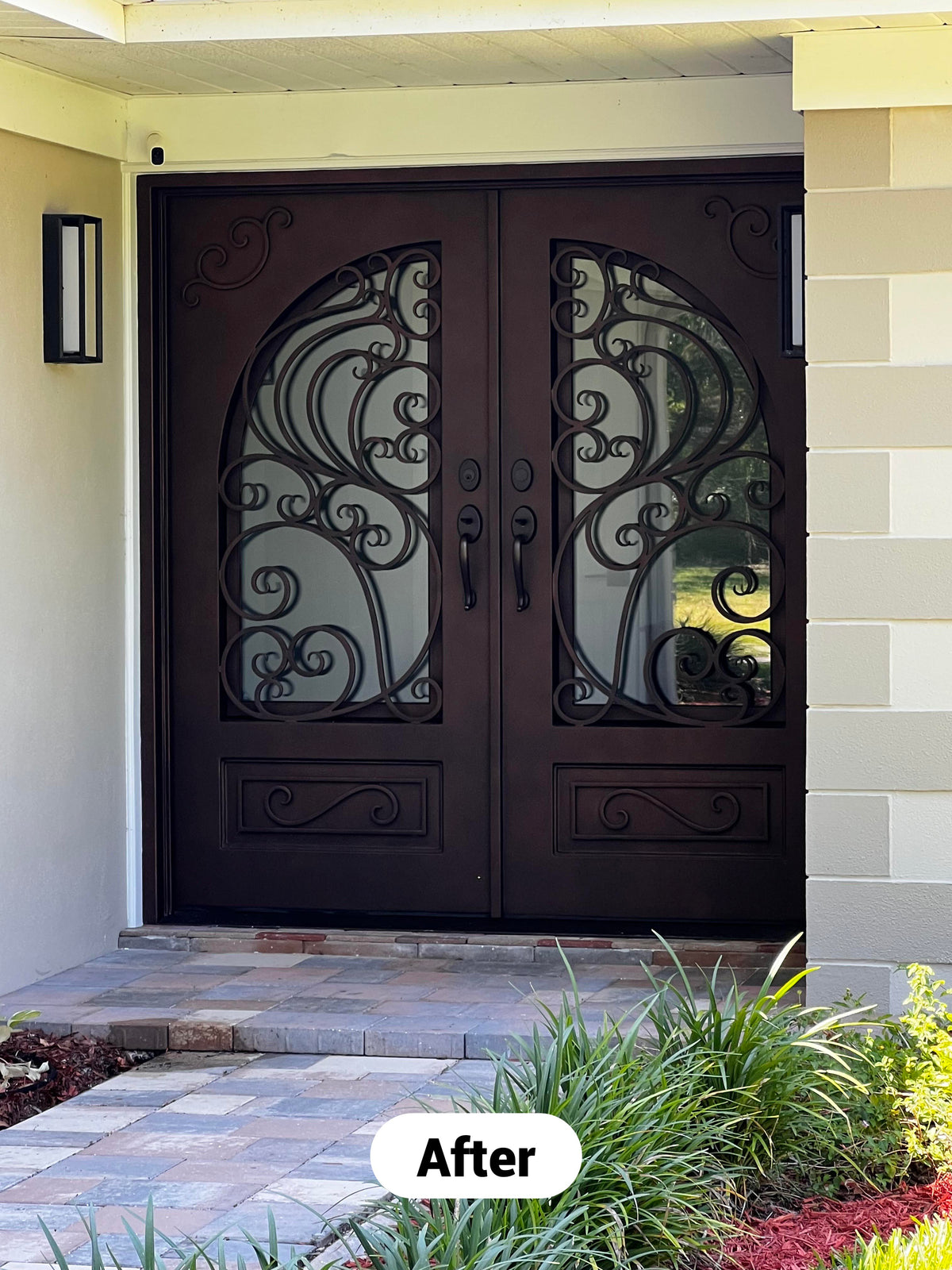 Completed custom iron front double door installation