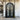 Decorative black metal door with intricate designs and round top