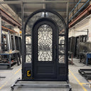 Arched iron single front door with sidelights and round transom