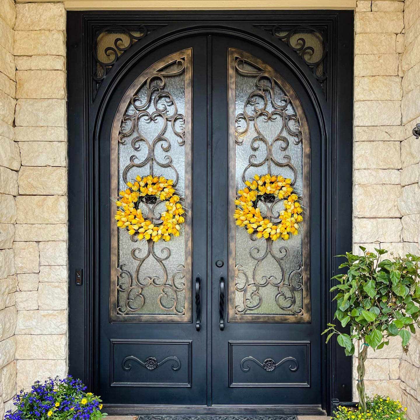 Wrought iron double door with square outside round inside top