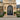 Elegant black double doors with decorative patterns with round top