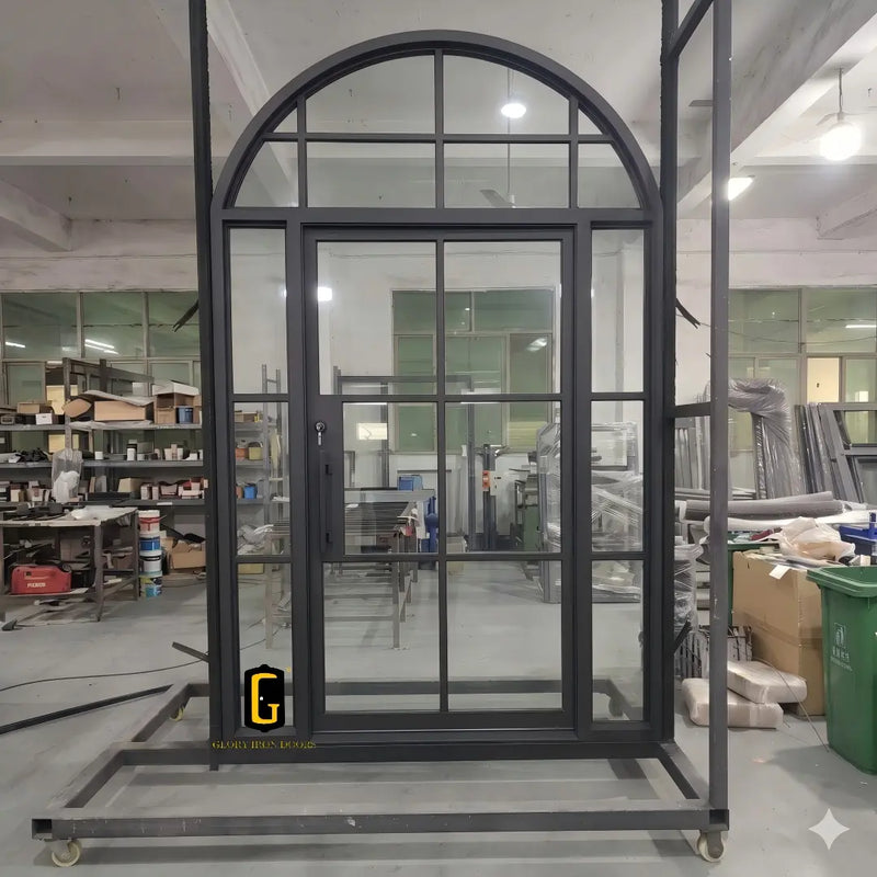 Single iron French front door with side lights and upper round transom