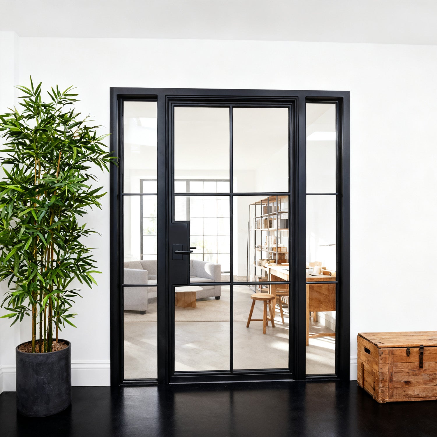 Modern black-framed interior door with double sidelights