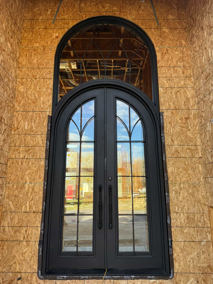 how is an iron double door with a large transom installed