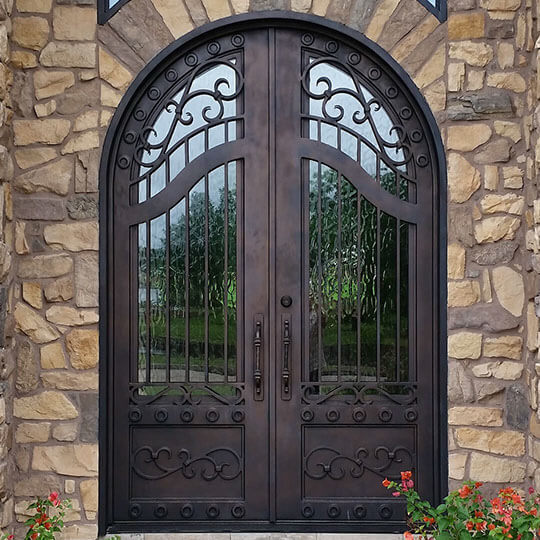 double iron door with rusty red frame and clear glass