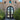 iron french double door with round top and hurricane proof glass