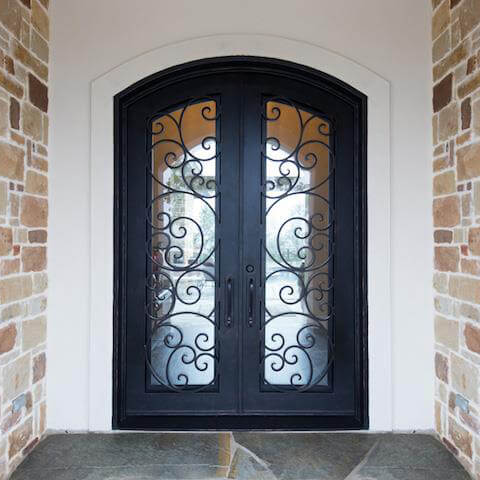 double iron door with matte black frame and arched top