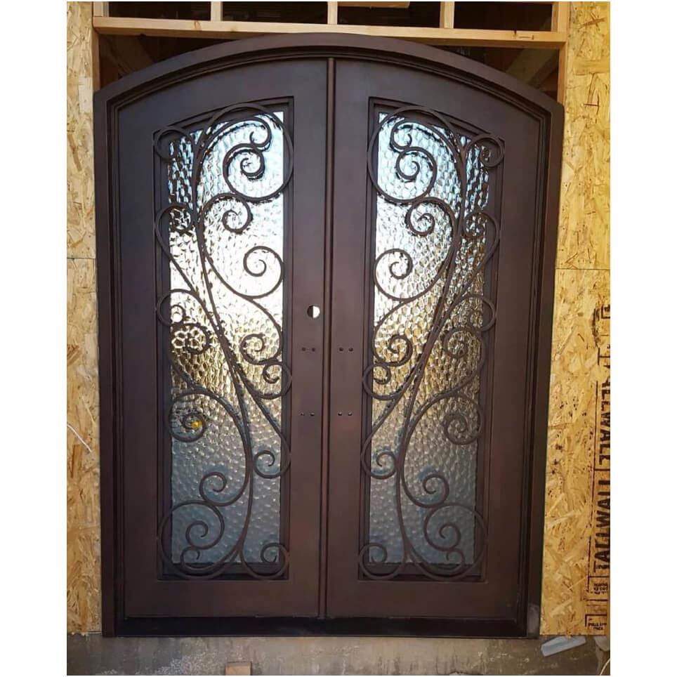 double iron door with scrollwork and glass