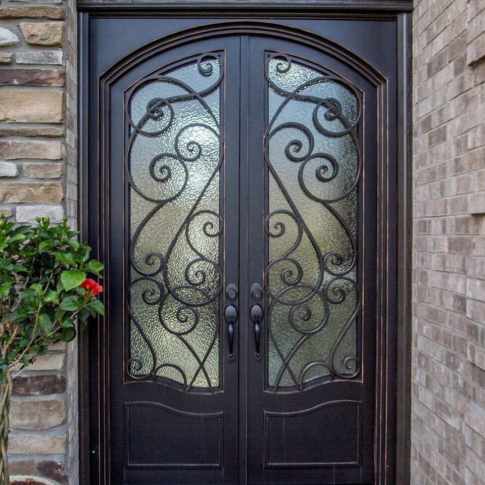 double iron door with decorative scrollwork and square top arched inside