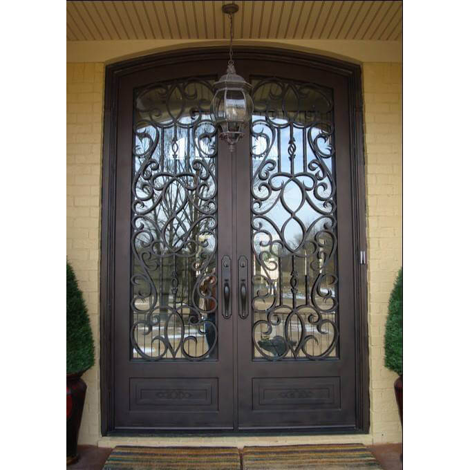 double iron door with arched top and clear glass
